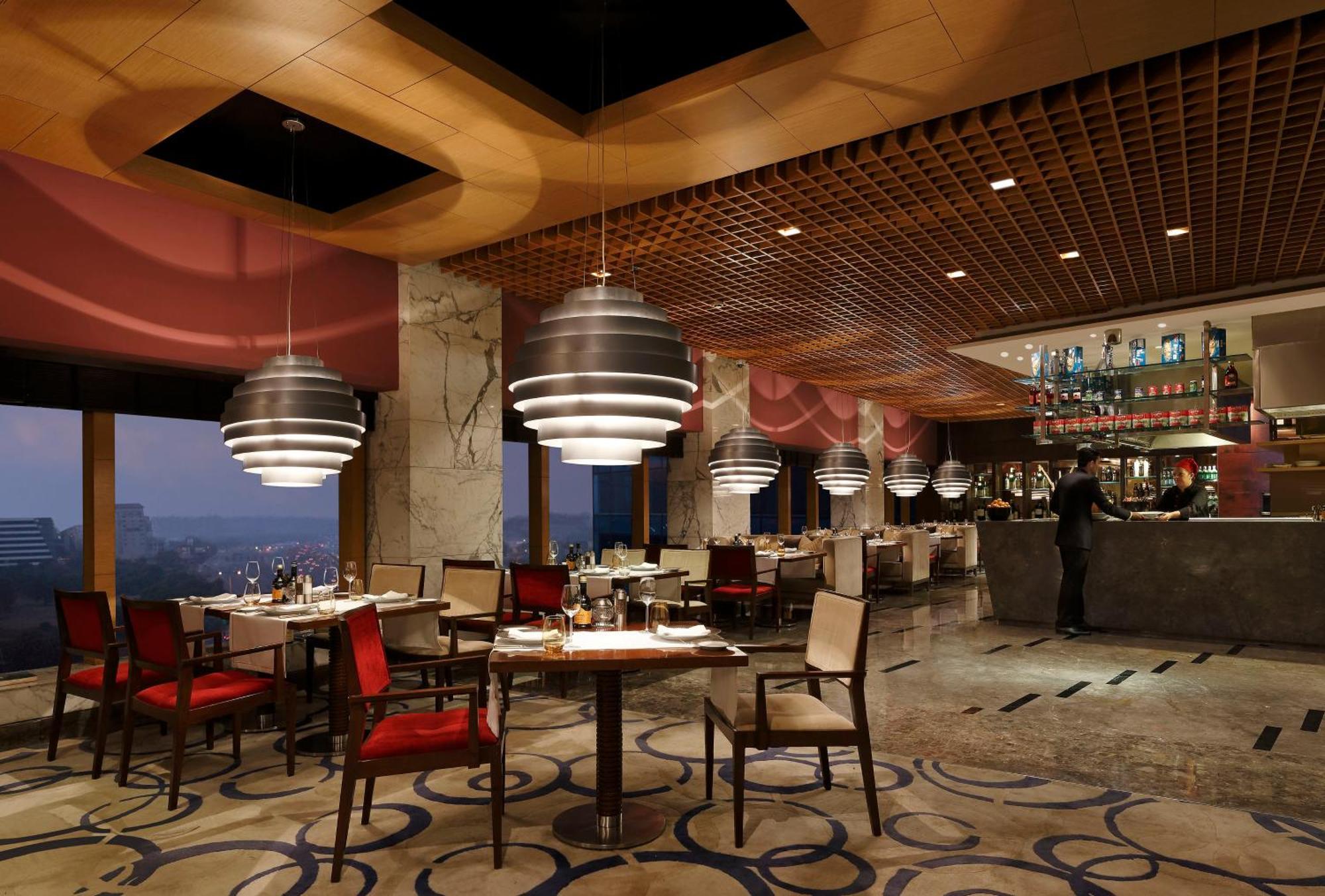 The Leela Ambience Gurugram Hotel & Residences - The Luxury Urban Sanctuary Gurgaon Exterior photo The restaurant
