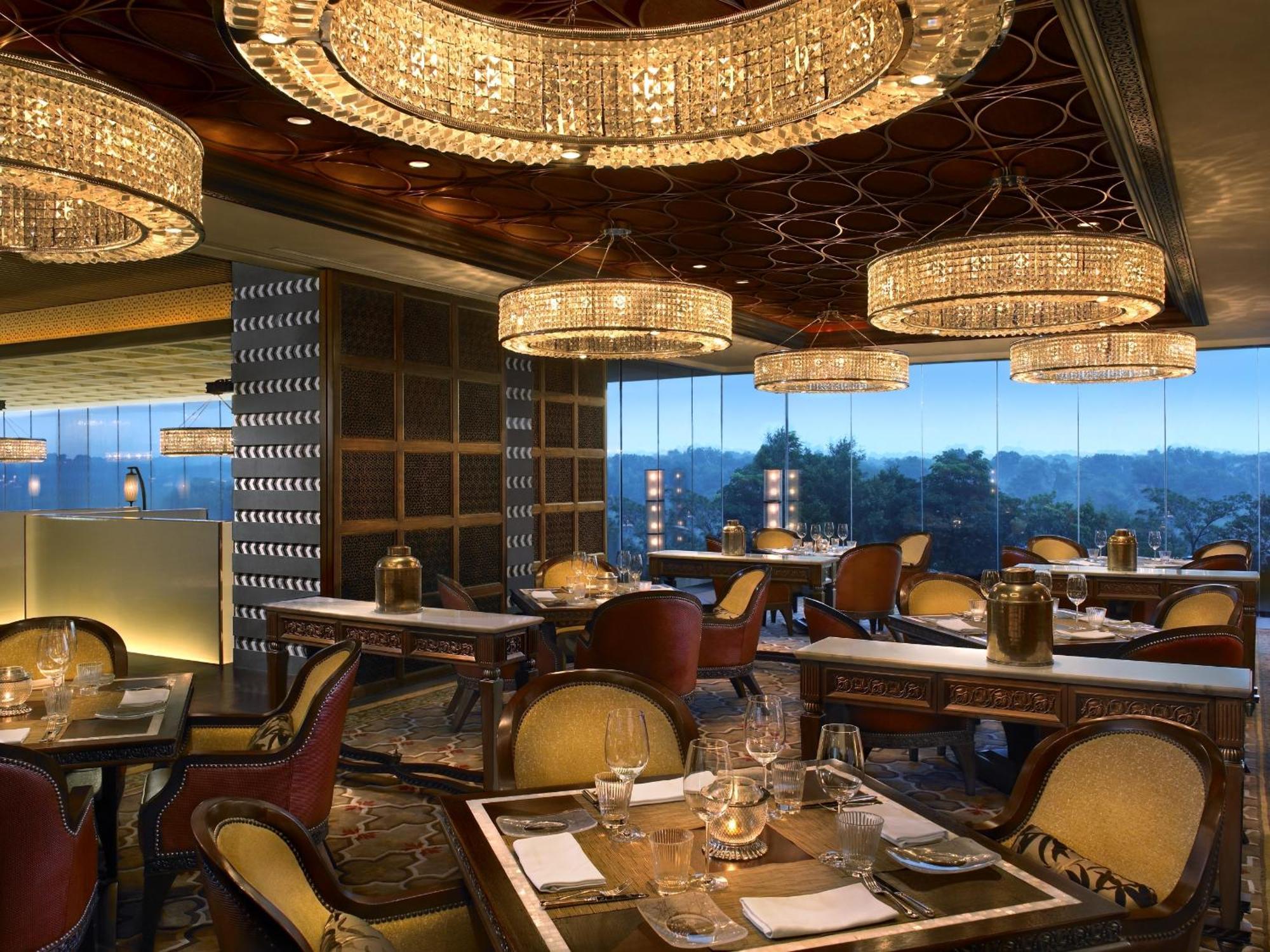 The Leela Ambience Gurugram Hotel & Residences - The Luxury Urban Sanctuary Gurgaon Restaurant photo The interior of the restaurant